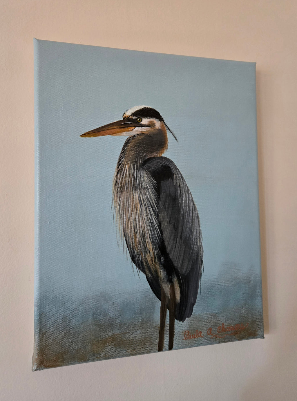 Blue heron standing in water acrylic painting titled 'Still Waters' by Paula A. Chavers, coastal bird wall art 11x14 for beach house decor.