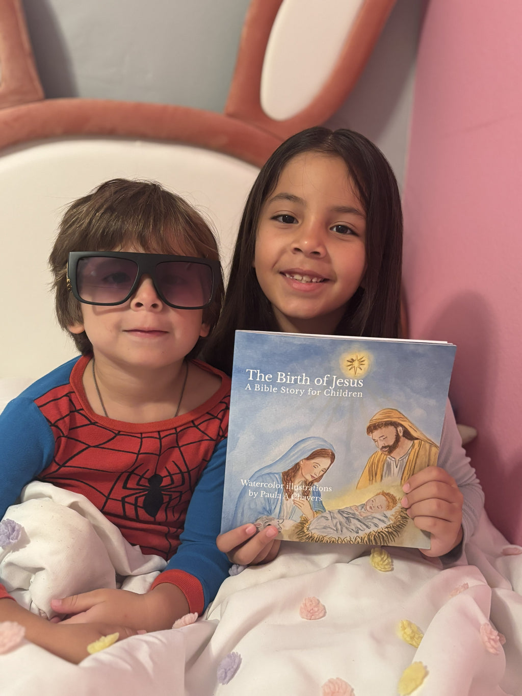 Children reading The Birth of Jesus illustrated Bible story book for kids