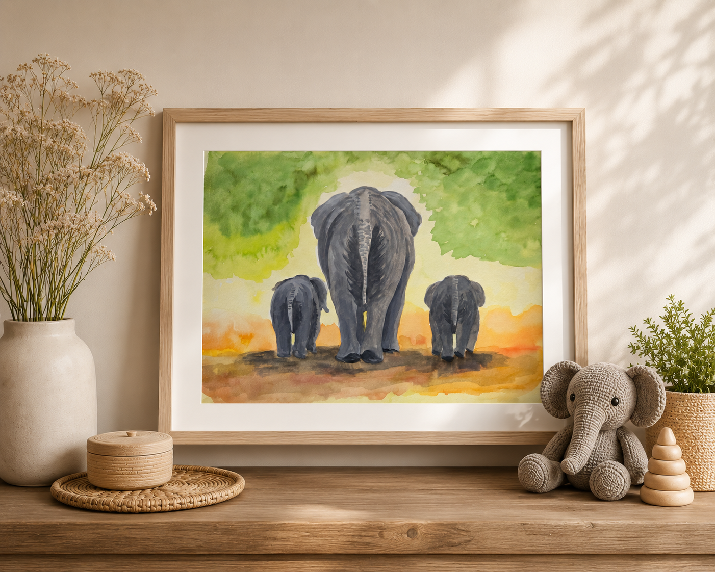Original watercolor painting of an elephant family walking together beneath soft green foliage and warm earthy tones, nursery and safari-inspired wall art by Paula A. Chavers.