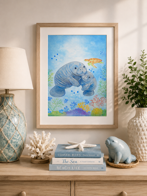 Original watercolor painting of a mother manatee hugging her baby underwater surrounded by coral reefs and a sea turtle, painted by Paula A. Chavers.