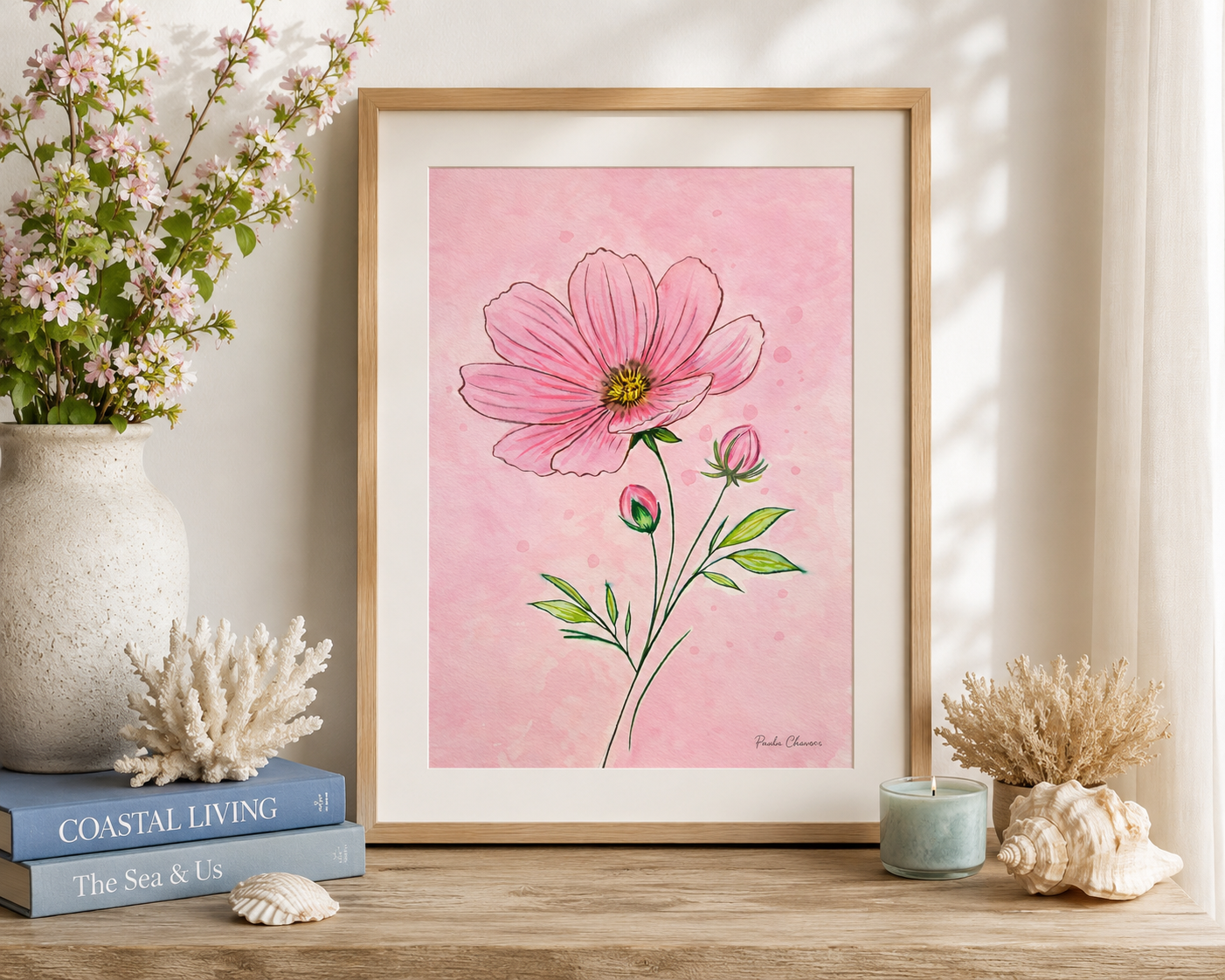 Original watercolor painting of a delicate pink cosmos flower with soft green leaves and buds against a blush pink watercolor background by Paula A. Chavers.