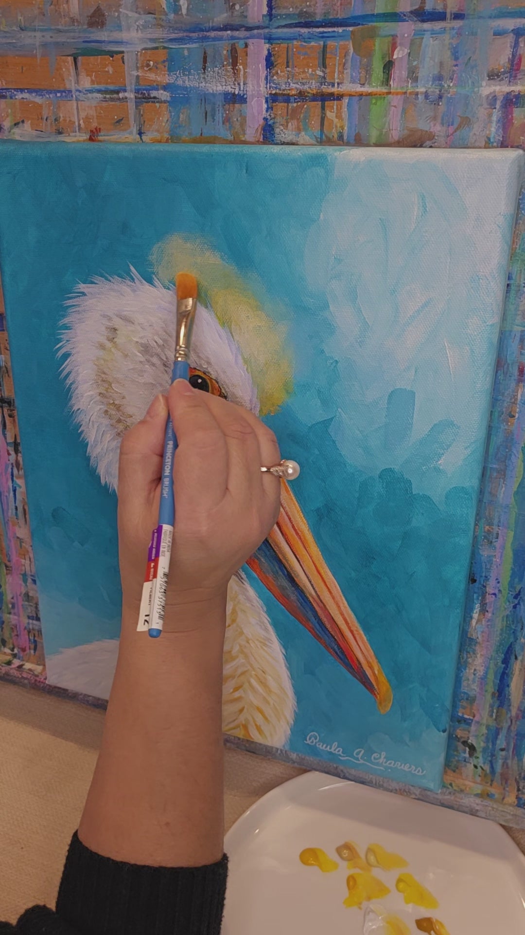 Paula A Chavers painting the Radiance of the Pelican, coastal wall art, modern pelican bird illustration for beach house decor.